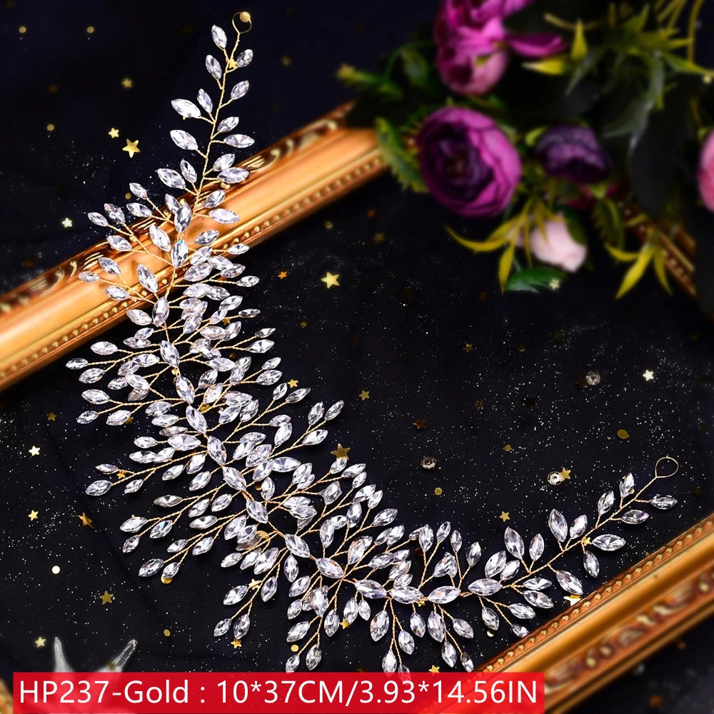 Diagonal perspective display of the HP237 gold bridal hair accessories vine, featuring faceted marquise crystals over a gold wire frame measuring 10 by 37 centimeters.