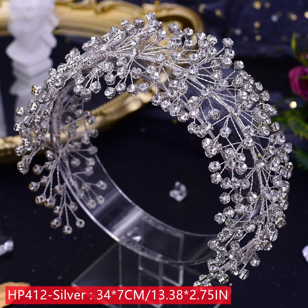 Direct product view of the HP412 silver wedding headwear headband featuring a high-density lattice of branching rhinestone sprigs measuring 34 by 7 centimeters on a clear stand.