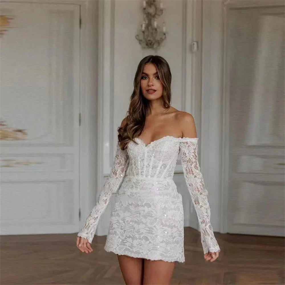 Elegant off-shoulder mini wedding dress featuring intricate floral lace, long sleeves, and a flattering sweetheart neckline, perfect for a modern bridal look.