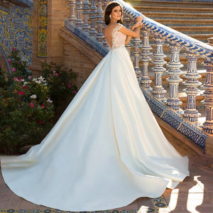 Backless Satin Princess Wedding Dress with Appliques and Beaded Cap Sleeves