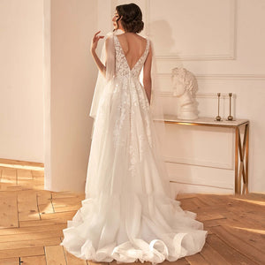 A-Line Sexy Backless V Neck Sleeveless Wedding Dress Luxury Spaghetti Straps Ribbons Sweep Train Bridal Gown
