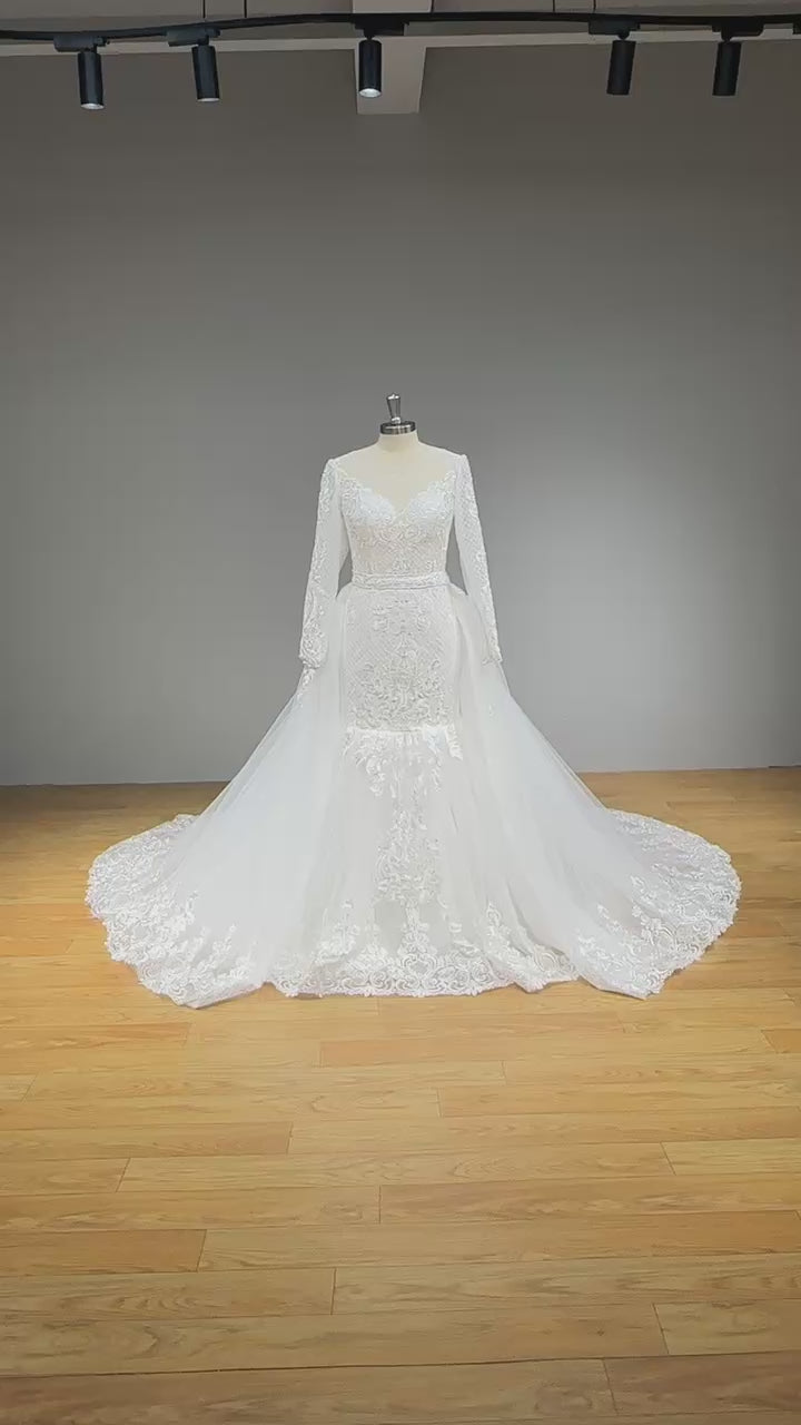 Load video: Long Sleeve Mermaid Wedding Dress with Detachable Train and Cut-out Back