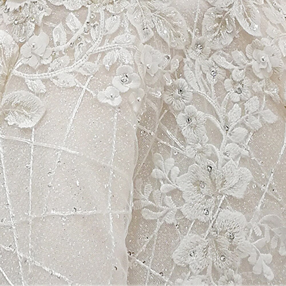 Close-up of the corset-style lace-up back closure on an elegant princess wedding gown.