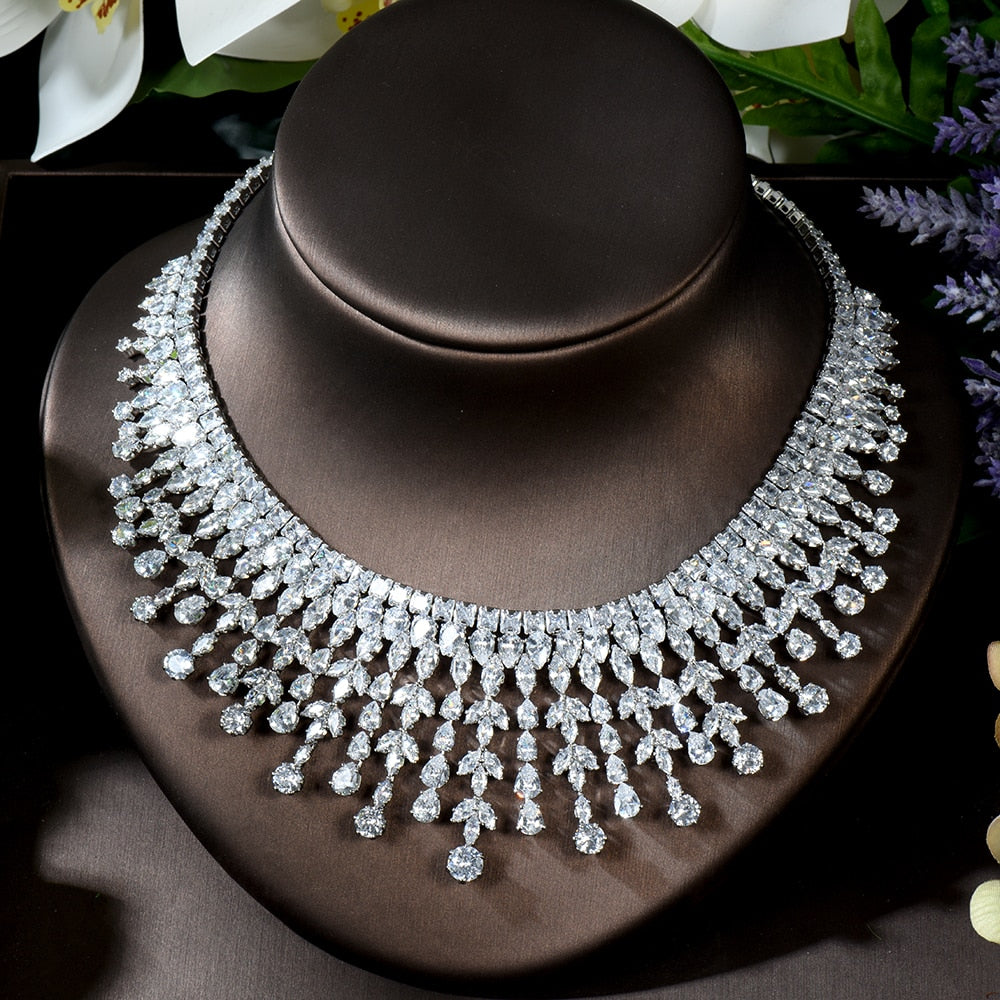 Direct studio photograph of the silver-plated cubic zirconia wedding necklace elegantly draped on a leather display bust to showcase the light-refracting clarity of the tiered dangling gemstones.