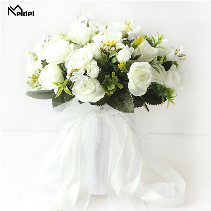 Front perspective of a pure white silk rose wedding bouquet featuring a handle wrapped in pristine white satin and sheer organza ribbons.