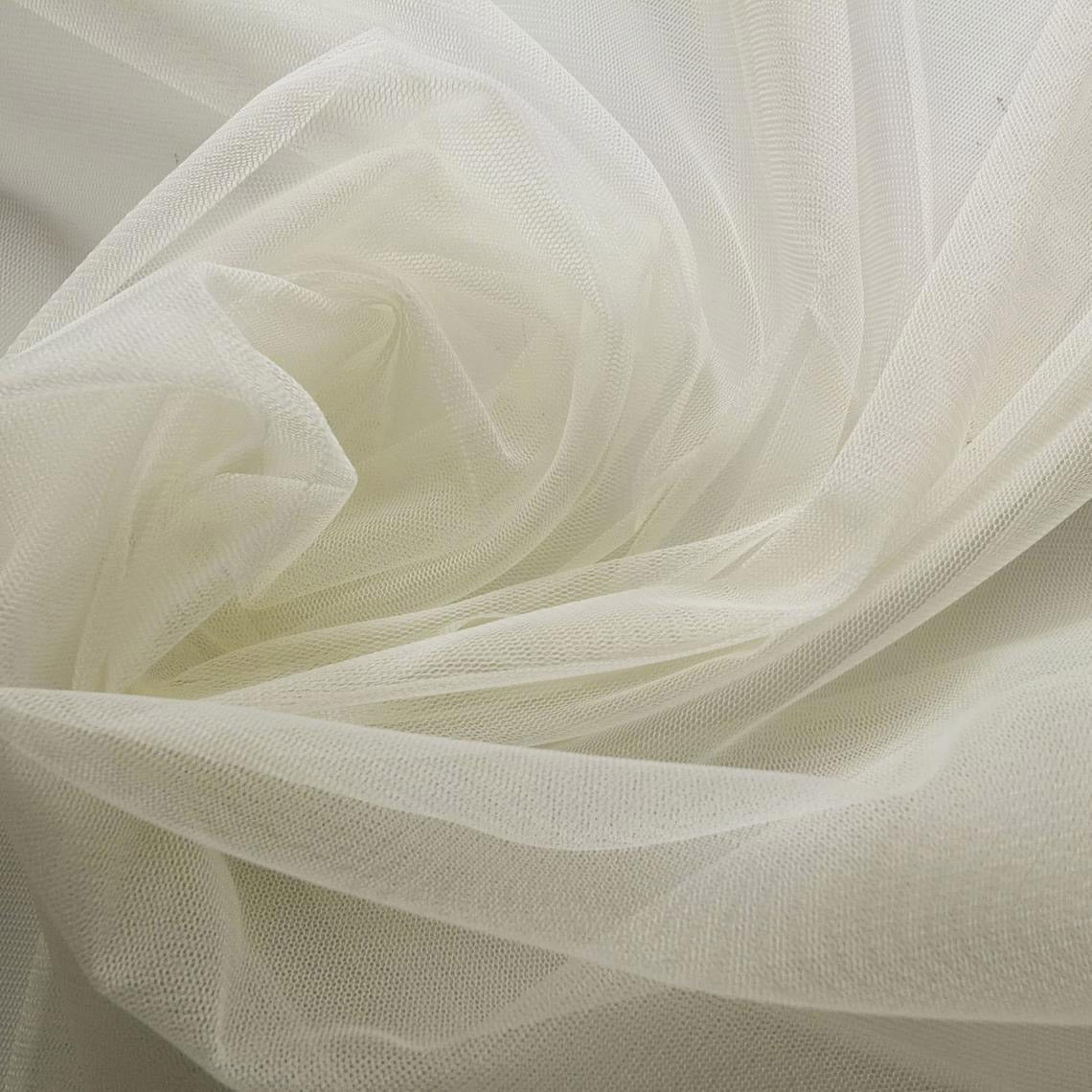 A close-up view of high-quality, sheer white tulle fabric with a fine mesh texture for bridal designs.