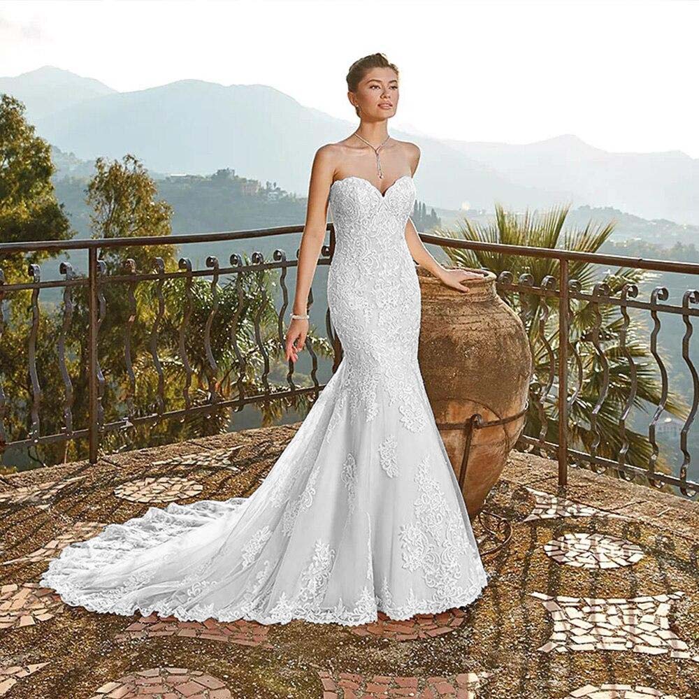 Front view of a strapless lace mermaid wedding dress with a fitted bodice and flared skirt.
