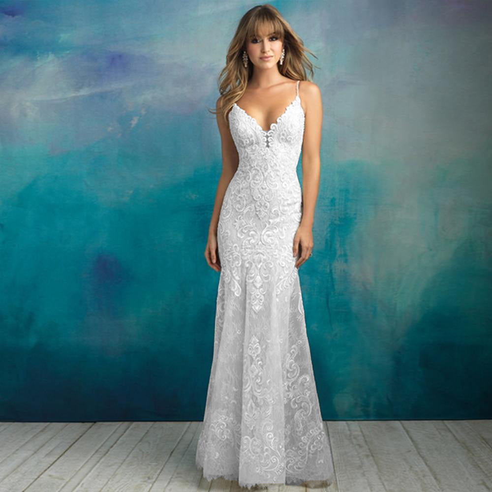 Elegant front view of a model wearing a floor-length mermaid wedding dress with spaghetti straps and detailed beadwork.