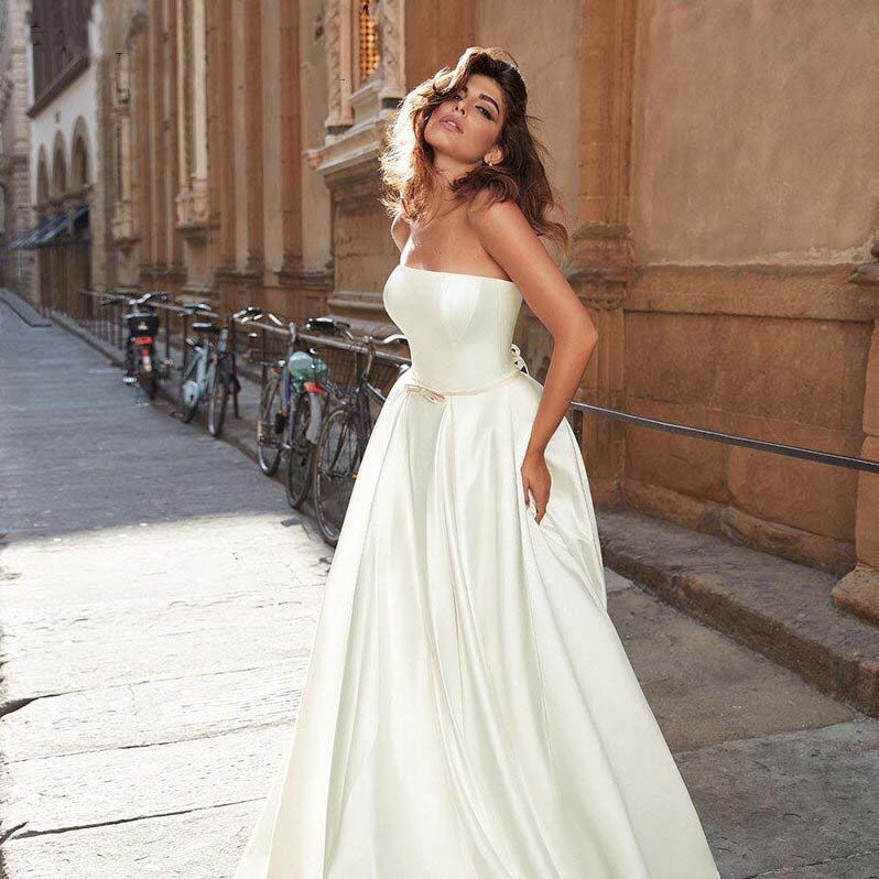 Close-up of the corset-style lace-up back closure on an elegant princess wedding gown.