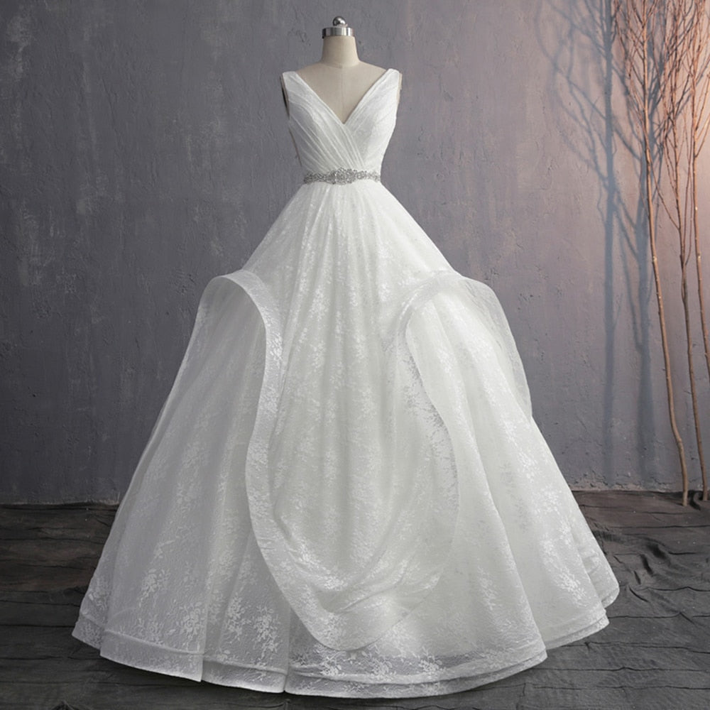 Front-angle view of an elegant ivory V-neck wedding dress on a mannequin, highlighting the clean, sophisticated design.